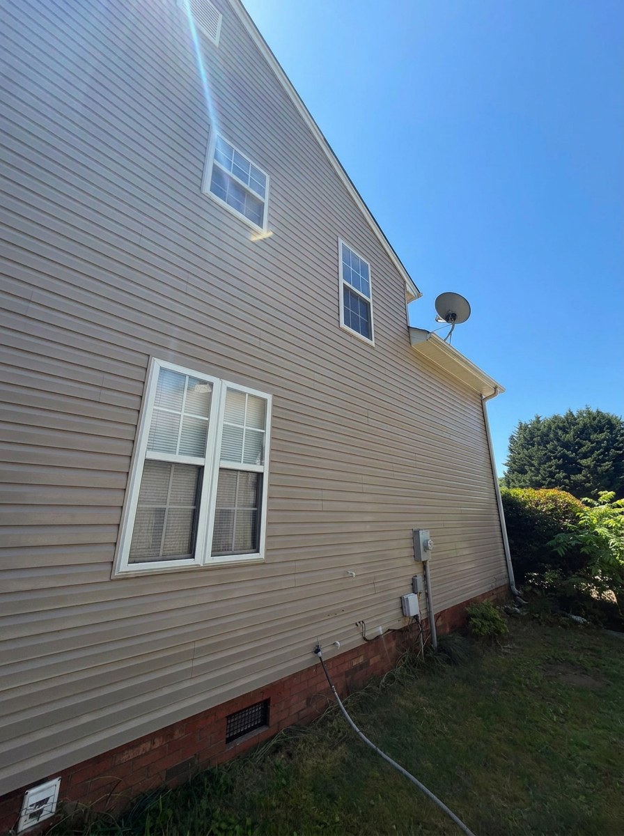 Two-story house side after cleaning